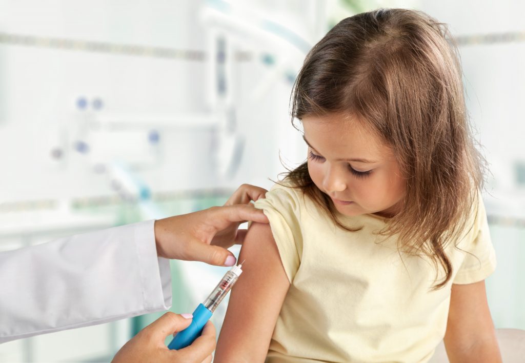 Child getting vaccine,