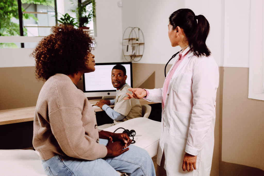 Woman going over examination with doctor.